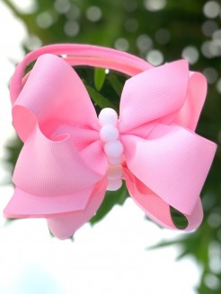 Pink bow headband with pom pom